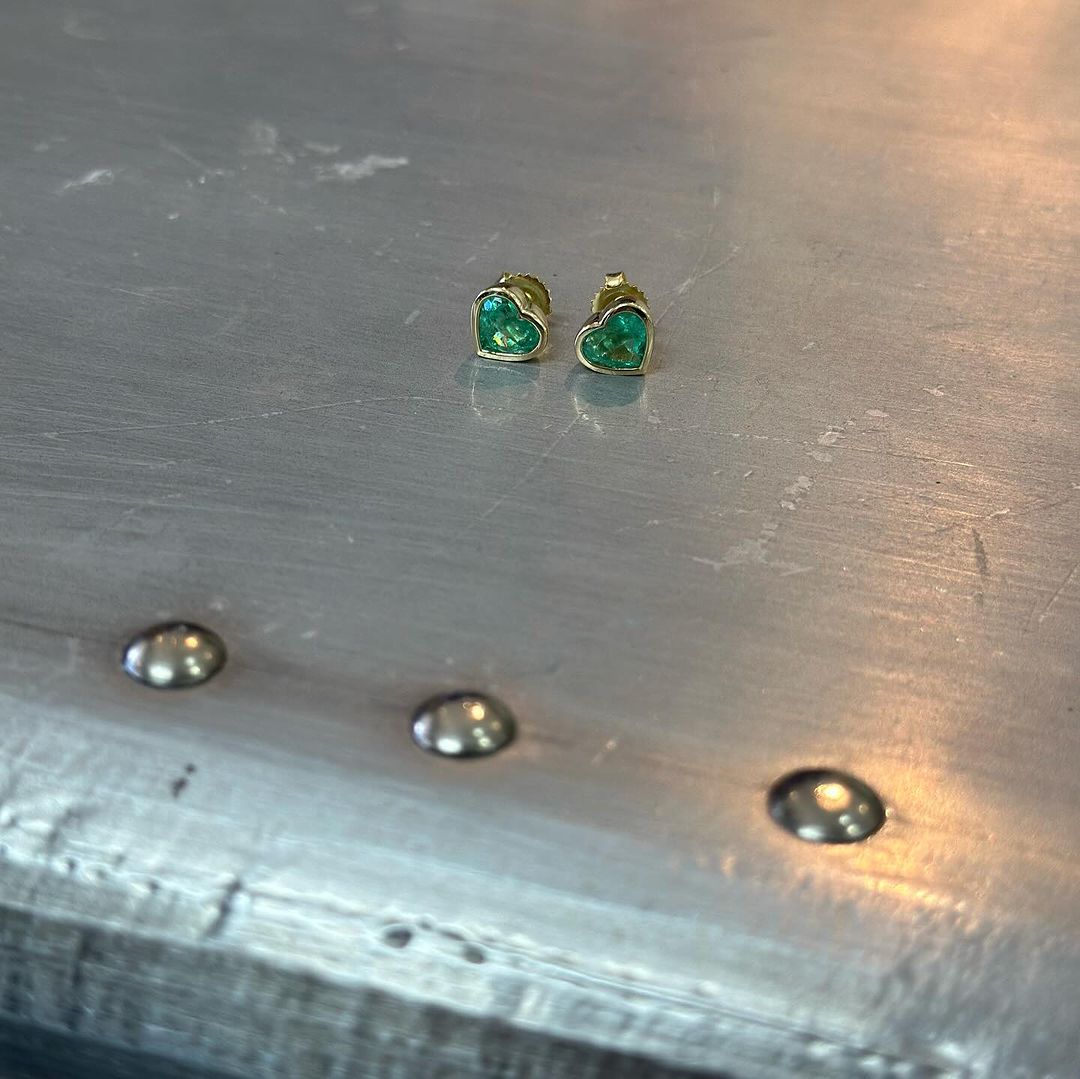 2.84tcw pair of Muzo emerald studs from in font.