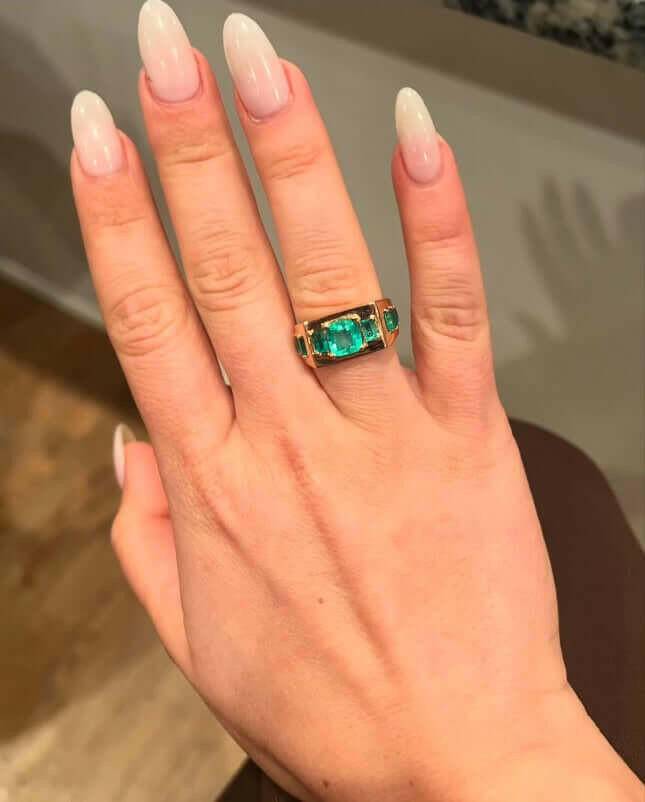 3 Carat Cushion Cut Colombian Emerald Ring in 18kt Gold in hand