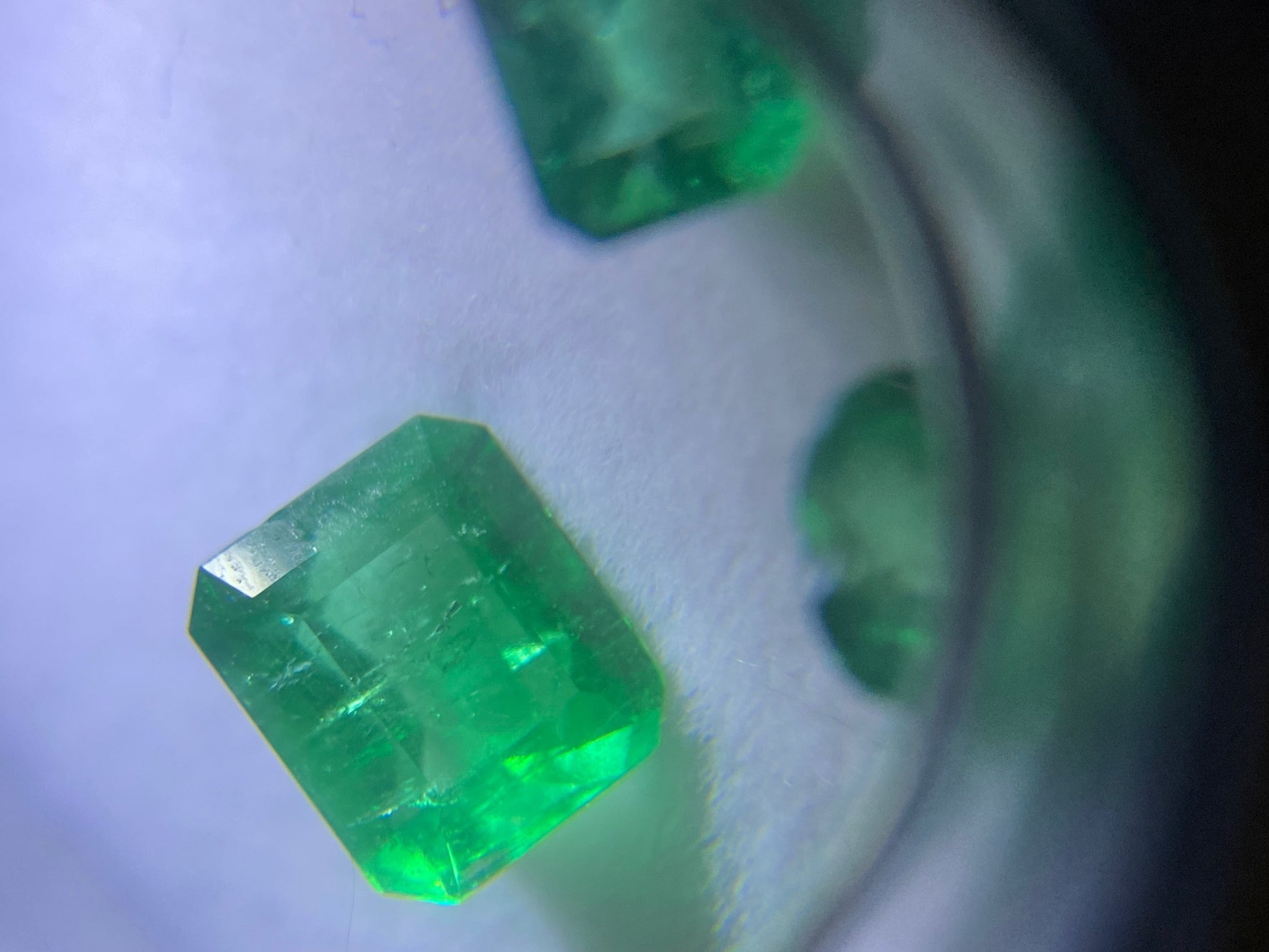 AAAA 3.4 carat Muzo octagon cut Colombian emerald lot close up