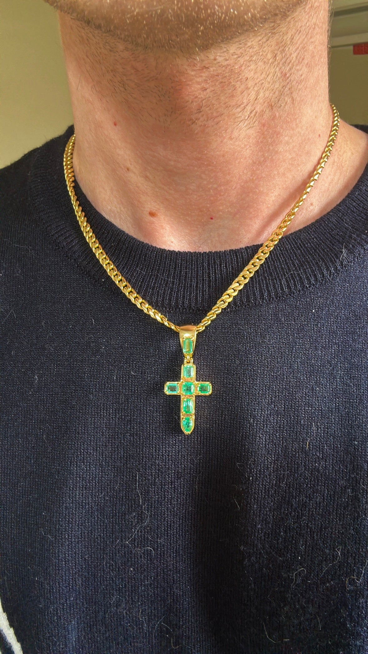 Modeling mini cross in 18kt gold, Colombian Muzo emerald.