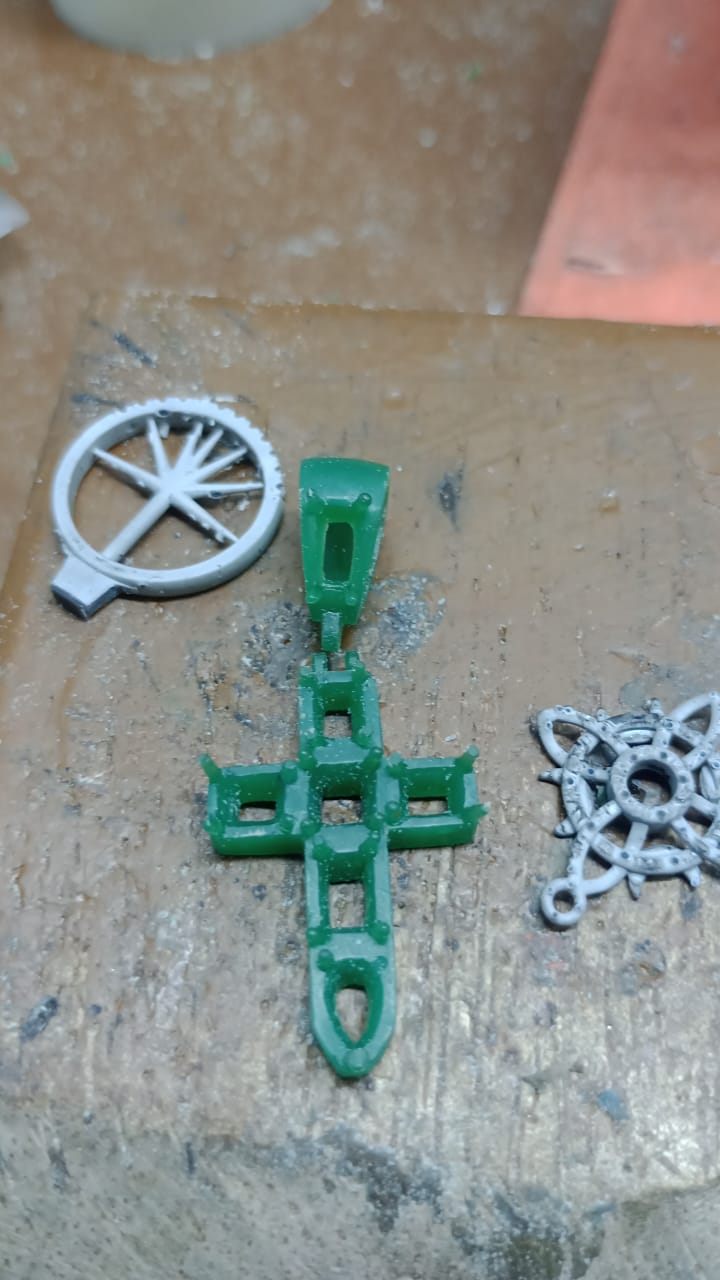 Wax carving of initial design of Muzo emerald mini cross.